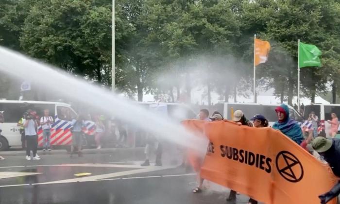 Dutch Police Use Water Cannon to Clear Climate Activists From Highway