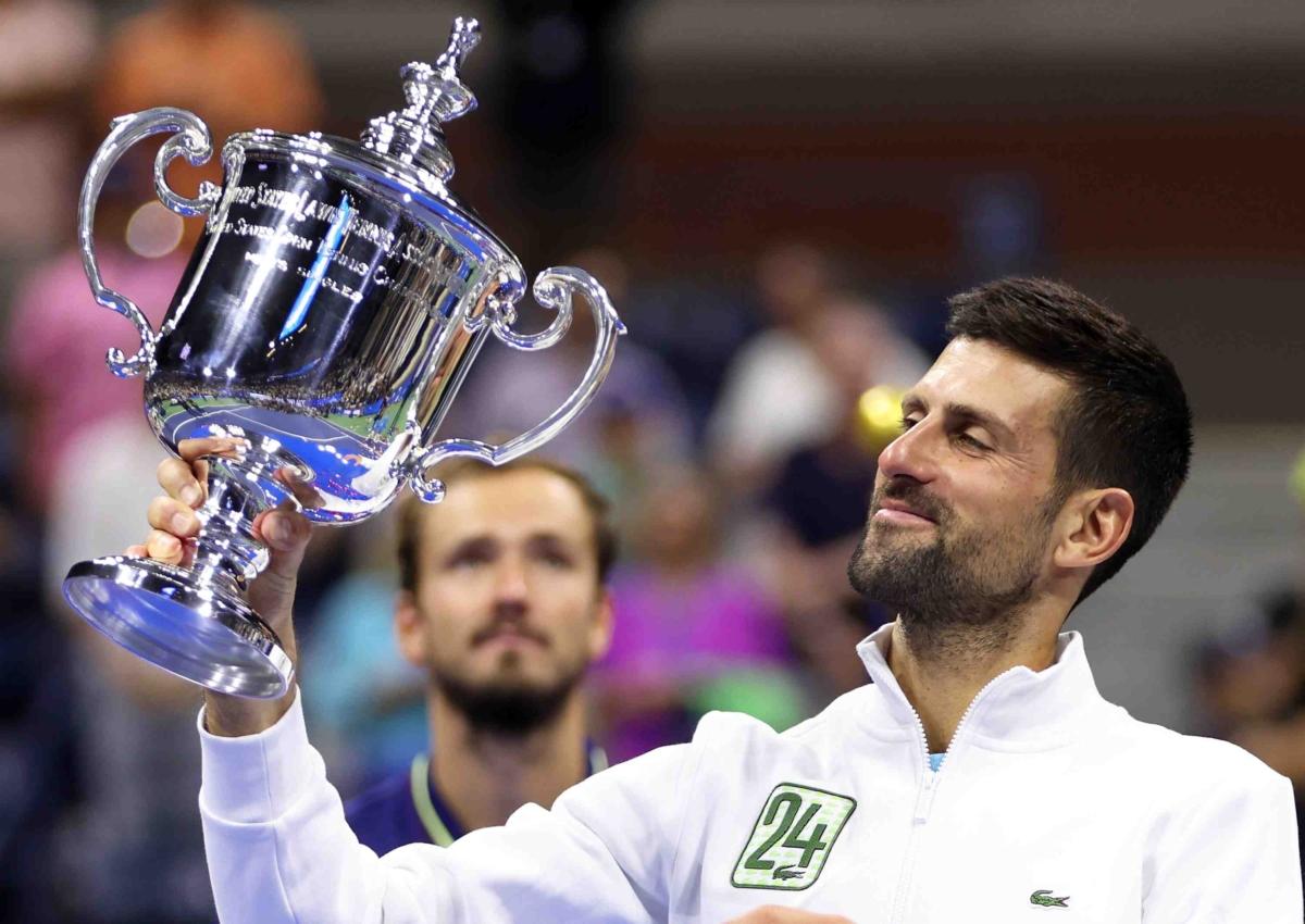 Novak Djokovic of Serbia holds aloft his winners trophy after defeating Daniil Medvedev of Russia during their Men's Singles Final match on Day Fourteen of the 2023 US Open at the USTA Billie Jean King National Tennis Center, in the Flushing neighborhood of the Queens borough of New York City, on Sept. 10, 2023. (Clive Brunskill/Getty Images)