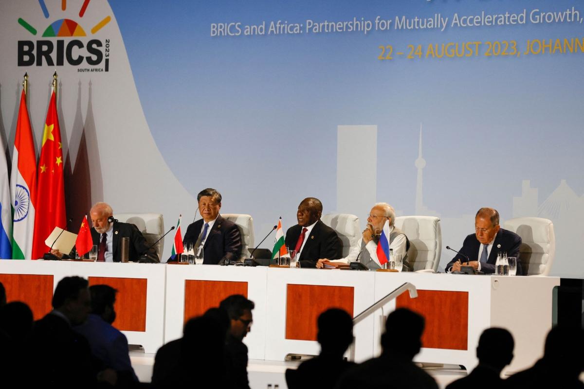 (L–R) Brazilian President Luiz Inácio Lula da Silva, Chinese leader Xi Jinping, South African President Cyril Ramaphosa, Indian Prime Minister Narendra Modi, and Russian Foreign Minister Sergey Lavrov attend the 2023 BRICS Summit at the Sandton Convention Center in Johannesburg on Aug. 24, 2023. (Phill Magakoe/AFP via Getty Images)