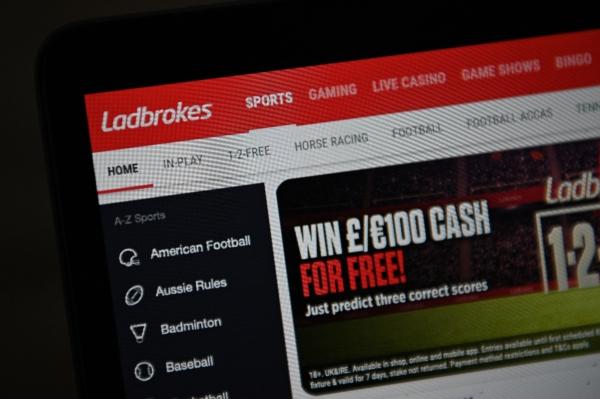 A photo illustration shows the website of Ladbrokes betting shop in London, the UK, on Sept. 22, 2021. (Daniel Leal/AFP via Getty Images)