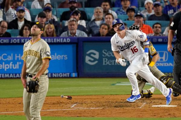 Los Angeles Dodgers' Will Smith, right, heads to first for hits a three-run home run as San Diego Padres starting pitcher Michael Wacha watches during the fourth inning of a baseball game in Los Angeles on Sept. 12, 2023. (Mark J. Terrill/AP Photo)