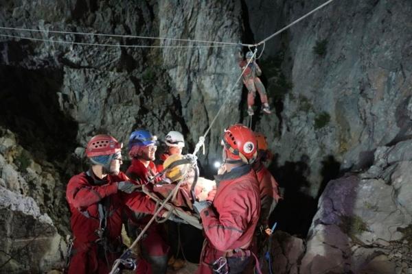 American researcher Mark Dickey (C) is pulled out of Morca cave near Anamur, south Turkey, on Sept. 12, 2023. (AFAD via AP)
