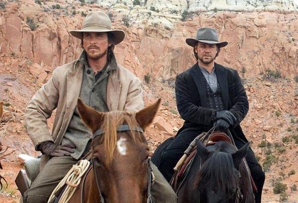 Dan Evans (Christian Bale, L) and Ben Wade (Russell Crowe) have a long journey to Yuma, in “3:10 to Yuma.” (Lionsgate)
