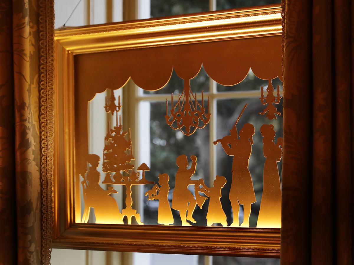 A window silhouette of U.S. President Thomas Jefferson playing the violin for his family in 1805. (Chip Somodevilla/Getty Images)