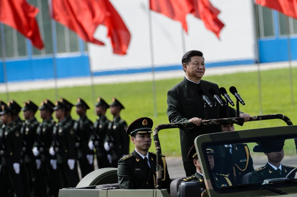  China's leader Xi Jinping reviews troops from a car at a garrison of the People's Liberation Army in Hong Kong on June 30, 2017. (Anthony Wallace /AFP via Getty Images)