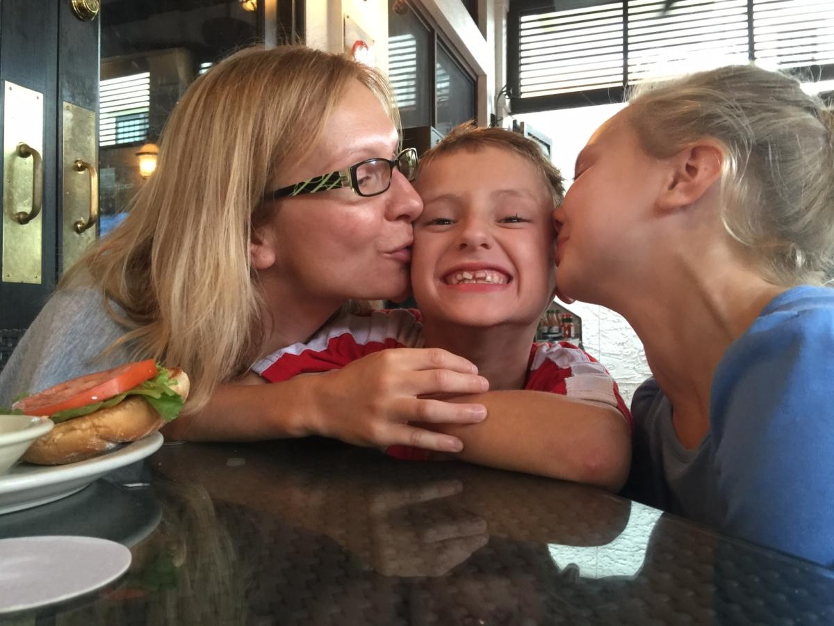 Beata Kowalski, (L) enjoys an outing with her children, Kyle (C) and Maya (R). (Courtesy of attorney Nick Whitney)