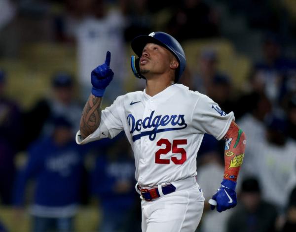 Kolten Wong (25) of the Los Angeles Dodgers celebrates his solo home run against the San Diego Padres during the ninth inning at Dodger Stadium in Los Angeles on Sept. 13, 2023. (Harry How/Getty Images)