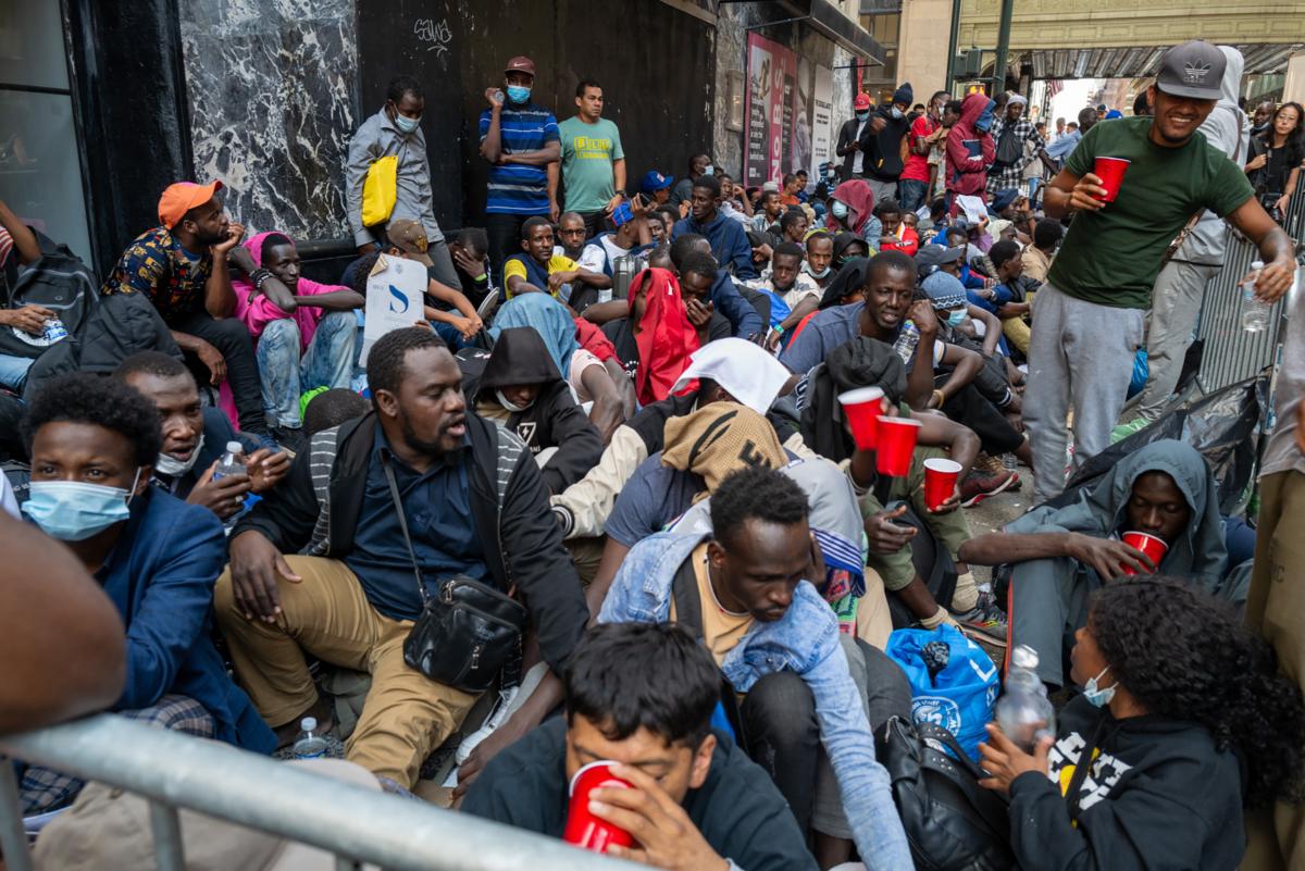 Dozens of recently arrived illegal immigrants camp outside of New York's Roosevelt Hotel, which has been made into a reception center, as they try to secure temporary housing in New York City on Aug. 1, 2023. (Spencer Platt/Getty Images)