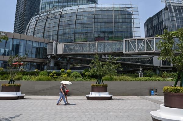 Removed company signage (top L) is seen in a general view of the unoccupied Evergrande Centre building in Shanghai on July 27, 2022. (Hector Retamal /AFP via Getty Images)