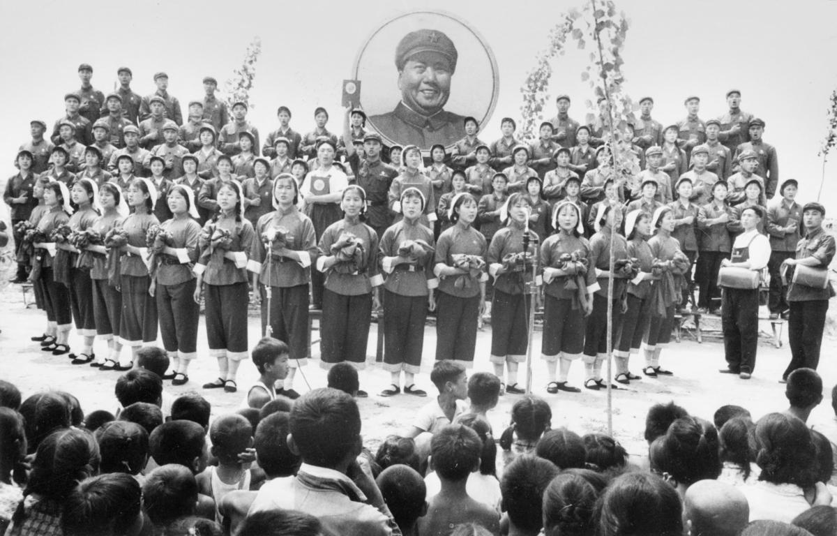 Members of China Popular Liberation Army's choir perform songs under a portrait of Chairman Mao Zedong near Beijing, on July 10, 1967. The song celebrates Mao's thoughts and the "Great Proletarian Cultural Revolution." Since the Cultural Revolution was launched in May 1966 at Beijing University, Mao's aim was to recapture power after the failure of the "Great Leap Forward." The movement was directed against those "party leaders in authority taking the capitalist road." (China Out/Xinhua/AFP via Getty Images)