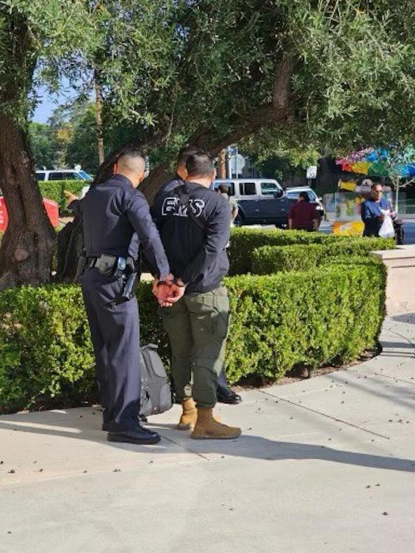 A suspect is taken into police custody outside an event attended by Democratic presidential candidate Robert F. Kennedy Jr, at Wilshire Ebell Theatre in Los Angeles, Calif., on Sept. 15, 2023. (Courtesy of Stefanie Spear)