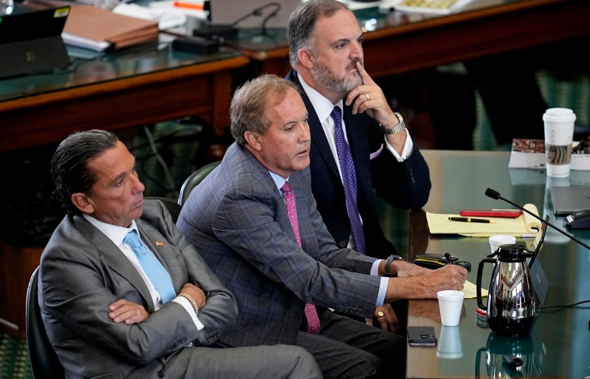 Suspended Texas state Attorney General Ken Paxton (C) sits with his attorneys Tony Buzbee (L) and Mitch Little (R) during his impeachment trial at the Texas Capitol in Austin on Sept. 15, 2023. (Eric Gay/AP Photo)