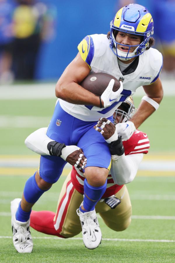 Puka Nacua (17) of the Los Angeles Rams is tackled by Drake Jackson (95) of the San Francisco 49ers during the first quarter at SoFi Stadium in Inglewood, Calif., at SoFi Stadium on Sept. 17, 2023. (Harry How/Getty Images)