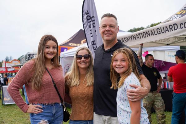 Port Jervis Police Chief William Worden and his family at the Moon Festival in the Town of Deerpark, N.Y., on Sept. 17, 2023. (Cara Ding/The Epoch Times)
