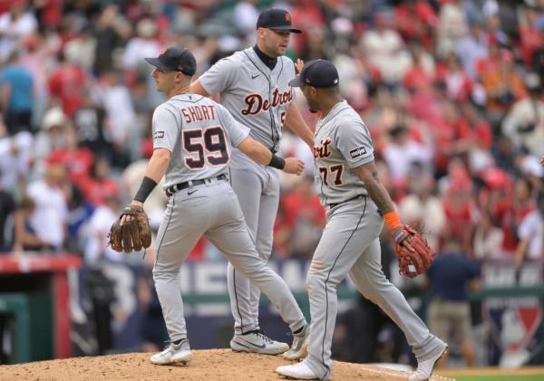 Pitcher Alex Lange of the Detroit Tigers is congratulated by Zack Short (59) and Andy Ibanez (77) after the final out in a win over the Los Angeles Angels at Angel Stadium of Anaheim in Anaheim, Calif., on Sept. 17, 2023 (John McCoy/Getty Images)