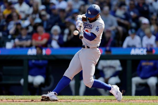 Los Angeles Dodgers' Jason Heyward hits an RBI single against the Seattle Mariners during the fourth inning of a baseball game in Seattle on Sept. 17, 2023. (John Froschauer/AP Photo)
