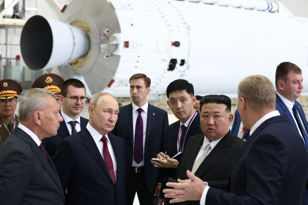In this pool photo distributed by Sputnik agency, Russian leader Vladimir Putin and North Korea's leader Kim Jong Un visit the Vostochny Cosmodrome in Amur region, on Sept. 13, 2023. (Vladimir Smirnov/POOL/AFP via Getty Images)
