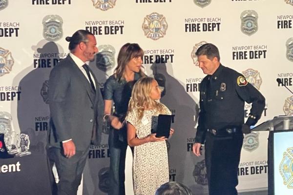 Newport Beach resident Fairuz Schlecht, who saved three young children from their apartment building during a fire that erupted on Lido Island in late December in 2022, is honored at the 25th Annual Newport Beach Awards Dinner in Newport Beach, Calif., on Sept. 14, 2023. (Carol Cassis/The Epoch Times)