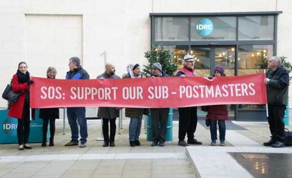 Protesters outside the Post Office Horizon IT inquiry at the International Dispute Resolution Centre in London, on Dec. 8, 2022. (PA)