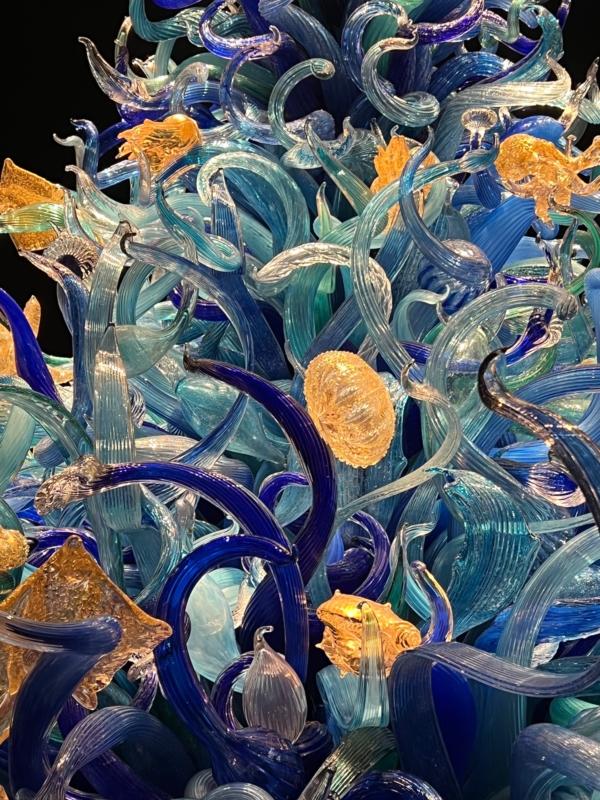 Golden sea creatures peek out from spirals of glass. (Courtesy of Karen Gough)