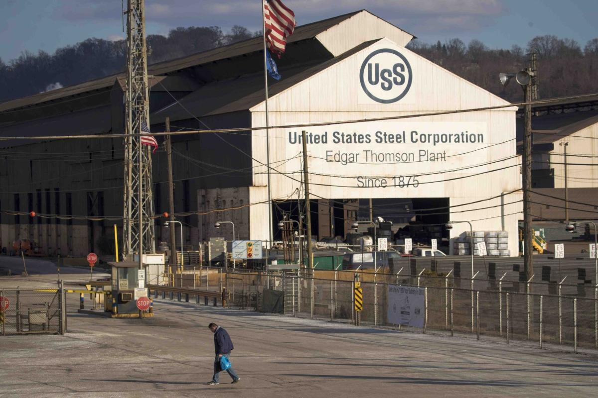 A worker leaves the U.S. Steel Corp. in Braddock, Pa., on March 10, 2018. (Drew Angerer/Getty Images)