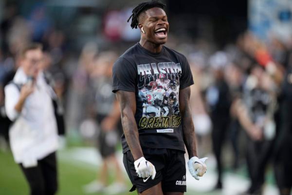 Colorado cornerback Travis Hunter warms up before an NCAA college football game against Colorado State in Boulder, Colo. on Sept. 16, 2023. (David Zalubowski/AP Photo)