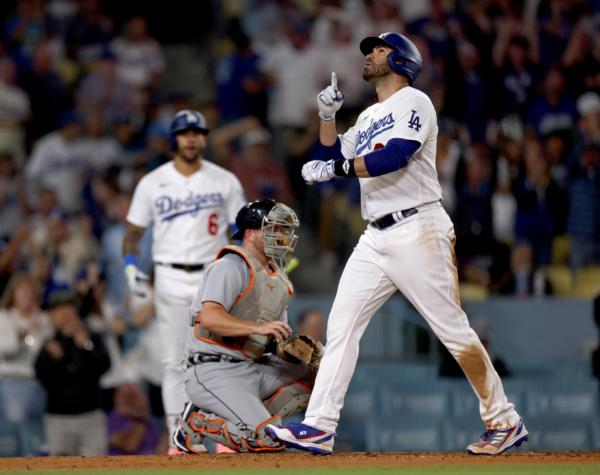 J.D. Martinez (28) of the Los Angeles Dodgers celebrates his solo home run in front of Jake Rogers (34) of the Detroit Tigers, to trail 2-1, during the fourth inning at Dodger Stadium in Los Angeles on September 19, 2023. (Harry How/Getty Images)