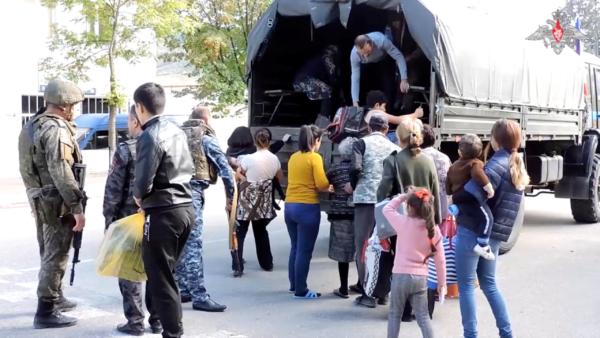  Russian peacekeepers evacuate civilians in the town of Askeran following the launch of a military operation by Azerbaijani forces in the region of Nagorno-Karabakh in this still image from video published on Sept. 20, 2023. (Russian Defence Ministry/Handout via Reuters)