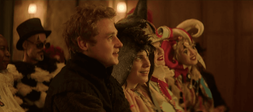  Oliver Jones (Ben Hardy, C) and his brother Luther (Tom Taylor, R) attend their mother's living memorial costume party, in "Love at First Sight." (Rob Baker Ashton/Netflix)