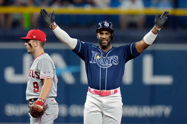  Tampa Bay Rays' Yandy Diaz reacts behind Los Angeles Angels shortstop Zach Neto (9) after his two-run double off relief pitcher Andrew Wantz during the sixth inning of a baseball game in St. Petersburg, Fla., on Sept. 20, 2023. (Chris O'Meara/AP Photo)