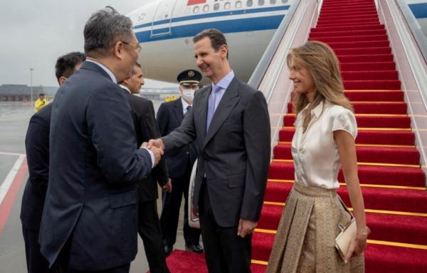 Syria's President Bashar al-Assad and wife Asma are welcomed upon their arrival at Hangzhou airport, China, on Sept. 21, 2023. (Syrian Presidency/Handout via Reuters)