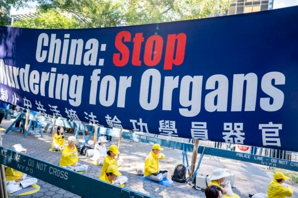 Falun Gong practitioners appeal next to the U.N. headquarters in New York City on Sept. 20, 2023. (Chung I Ho/The Epoch Times)