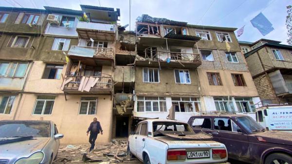  A view shows a damaged residential building and cars following the launch of a military operation by Azerbaijani armed forces in the city of Stepanakert in Nagorno-Karabakh, on Sept. 19, 2023. (Siranush Sargsyan/PAN Photo via Reuters)
