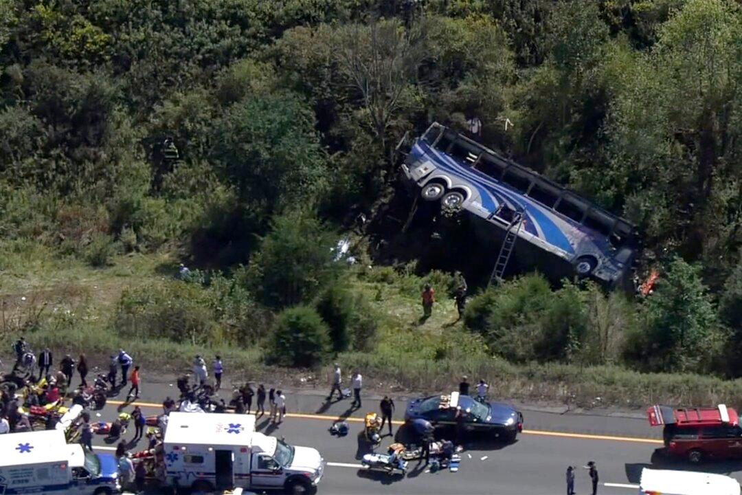 Bus Carrying High School Students to Band Camp Crashes, Killing 2 and Seriously Injuring Others