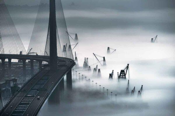 Mr. Tin's photo of a foggy Hong Kong International Terminals and Stonecutters' Bridge from 2016 was nominated for the "2017 National Geographic Travel Photographer of the Year" contest. (Provided by Mr. Tin)