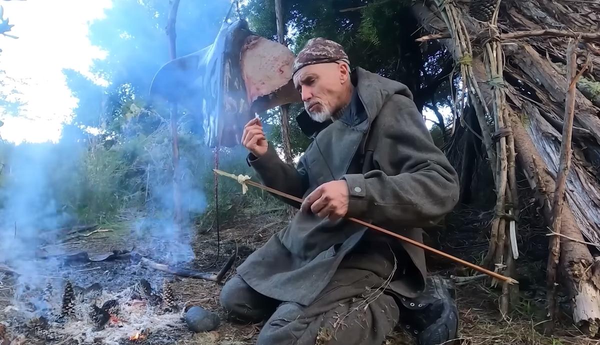 Clay cooks the eagle ray he speared on Day 4 of his survival challenge, saying that it tastes like crab meat. (Courtesy of Clay Tall Stories)