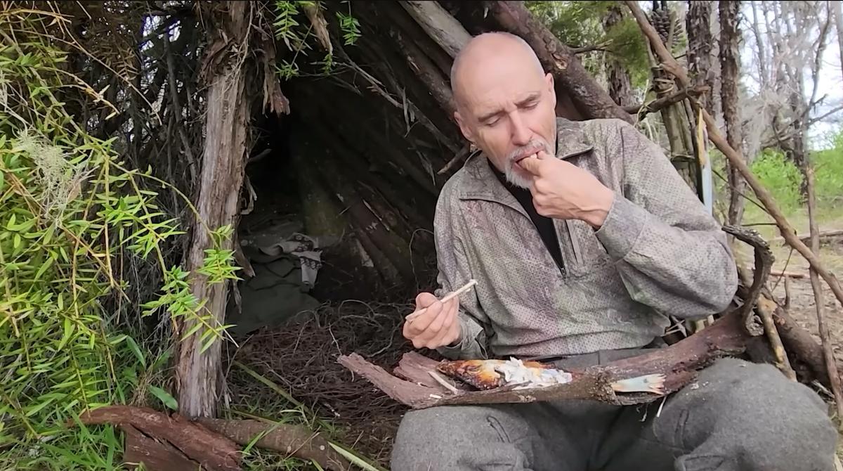 Clay feasts on flounder that he speared and cooked during his five-day survival challenge. (Courtesy of Clay Tall Stories)