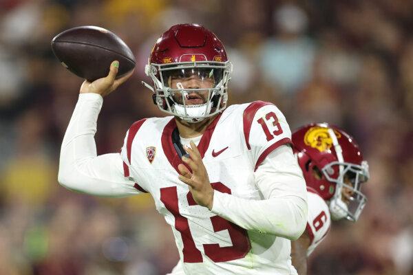 Quarterback Caleb Williams (13) of the USC Trojans throws a pass during the first half of the NCAAF game against the Arizona State Sun Devils at Mountain America Stadium in Tempe, Ariz., on Sept. 23, 2023. (Christian Petersen/Getty Images)