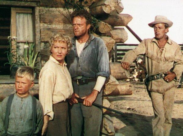 A still shot from the 1953 film “Shane” starring (L–R) Brandon De Wilde, Jean Arthur, Van Heflin, and Alan Ladd. (MovieStillDB)