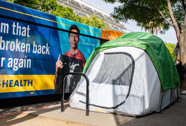 A homeless tent sits on a sidewalk in Sacramento, Calif., on April 18, 2022. (John Fredricks/The Epoch Times)
