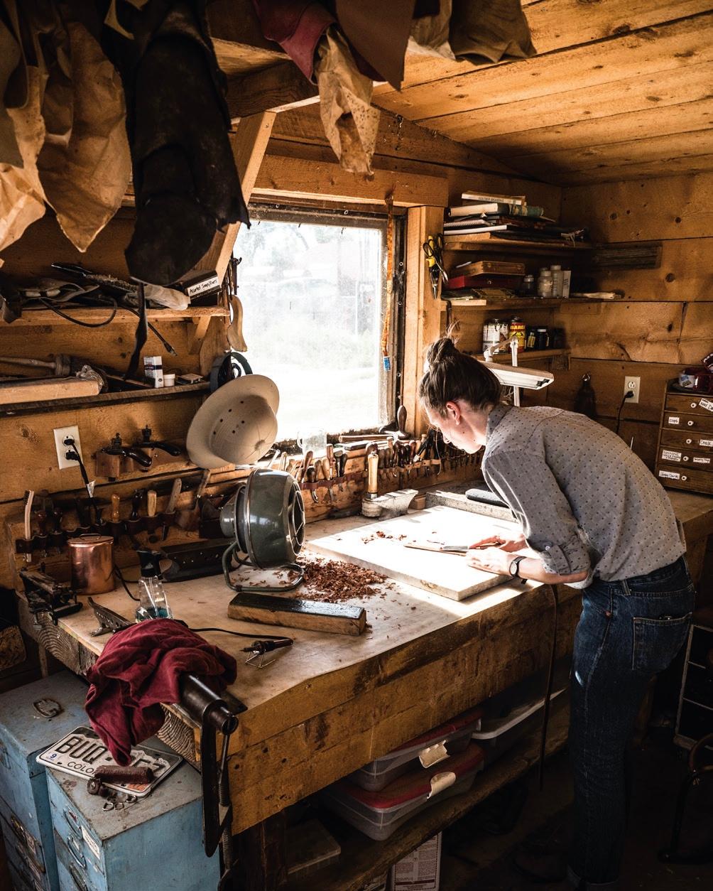 A worker at the leathershop at Chico Basin. (Claudia Landreville)