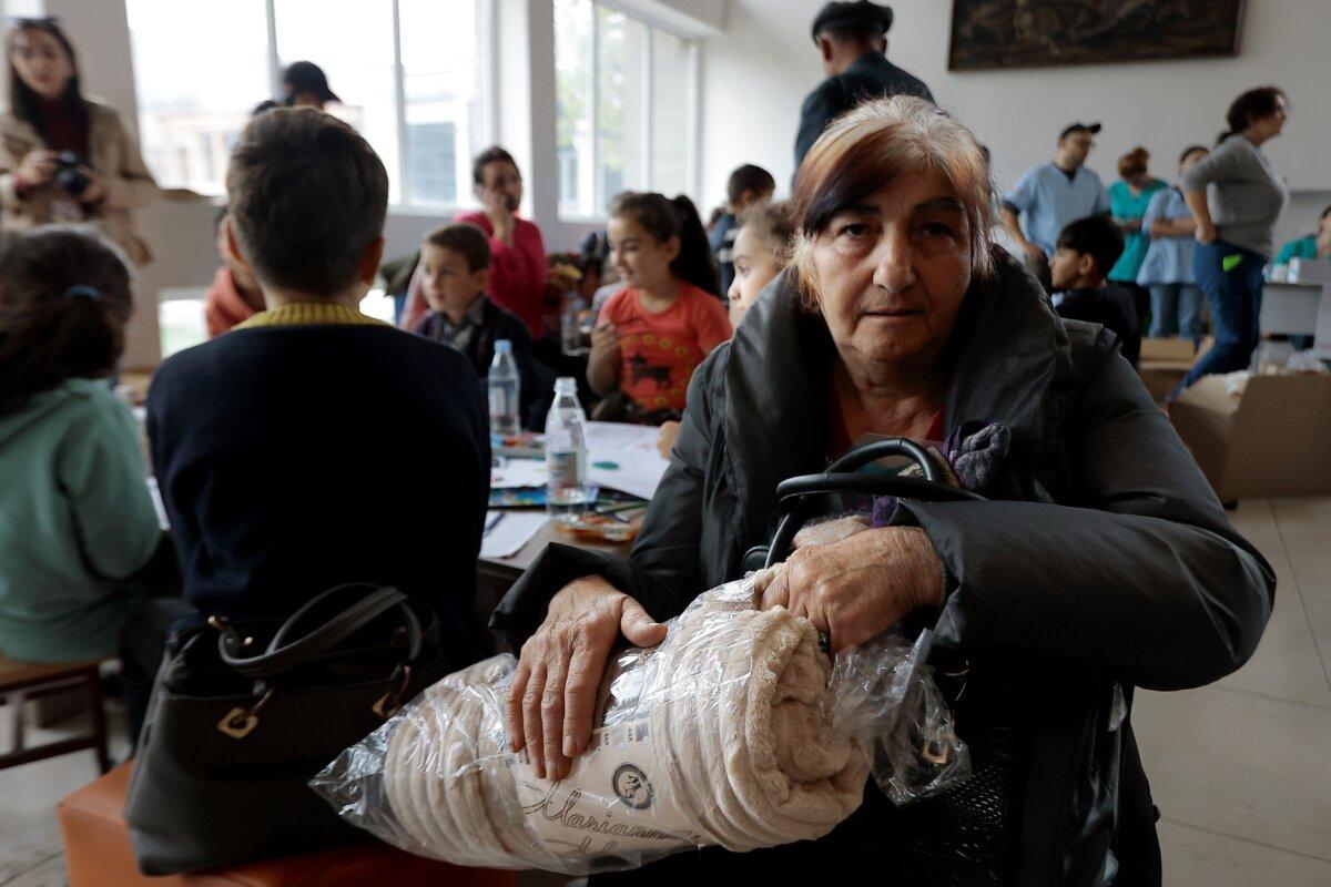 Ethnic Armenians from Nagorno-Karabakh gather as they wait to receive humanitarian aid at a temporary camp in Armenia's Goris in the Syunik region of Armenia, on Sept. 26, 2023. (Vasily Krestyaninov/AP Photo)