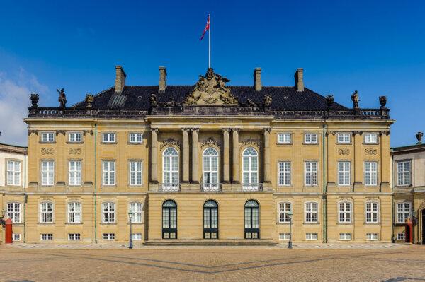 The majestic rococo façade of Christian VIII’s Palace, also known as Levetzau's Palace. Part of the palace is still used as a residence for the royal family, but the building also hosts both private and public reception rooms, as well as the Amalienborg Museum, open to visitors. The elegant stone façade forms a typical light rococo exterior, with German and French stylistic elements. Similar to traditional rococo exteriors, the façade is simple and only has light ornaments and delicate carvings surrounding the French windows, topped by some statues.(Anton_Ivanov/Shutterstock)