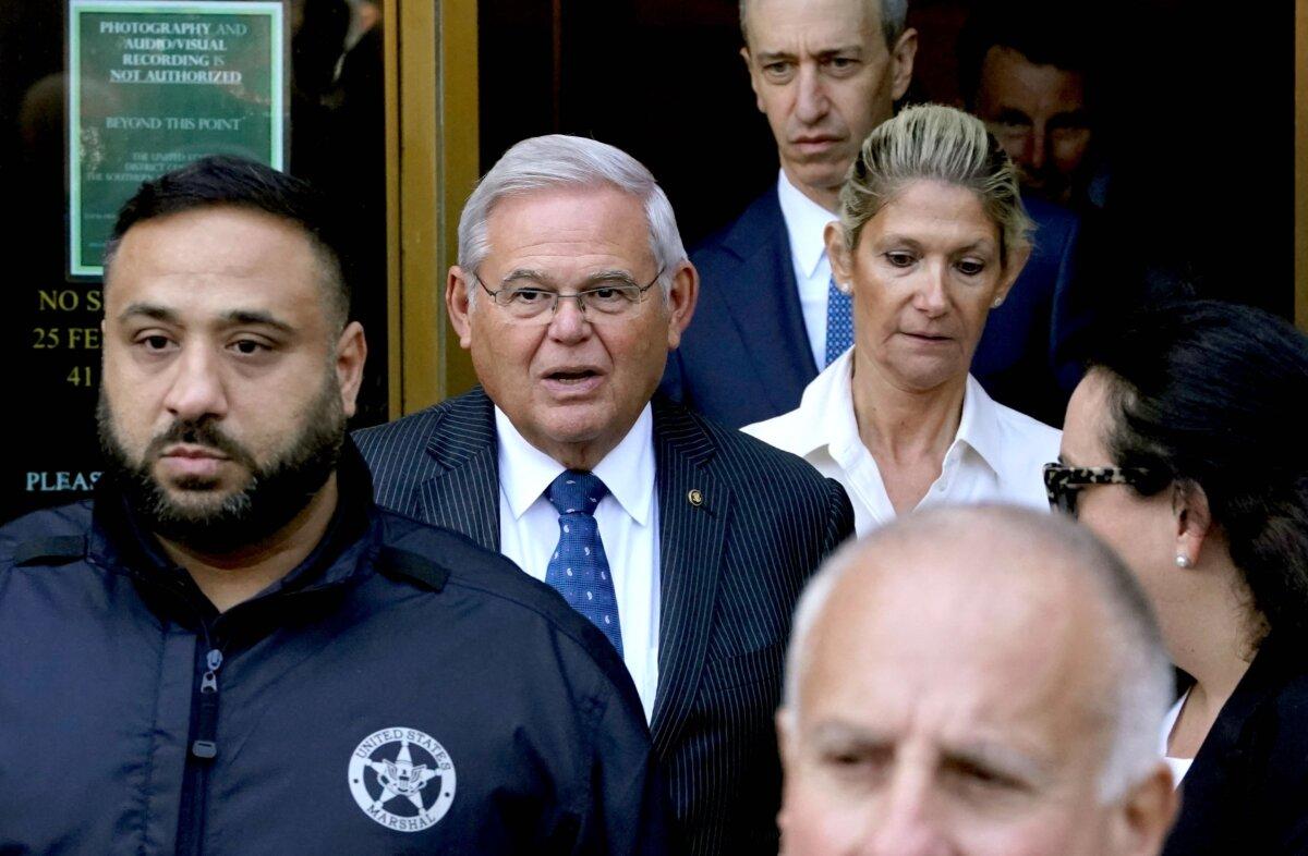 Sen. Bob Menendez (D-N.J.) (2nd L), with his wife Nadine Arslanian (R), leaves U.S. District Court for the Southern District of New York, in New York on Sept. 27, 2023. (Timothy A. Clary/AFP via Getty Images)