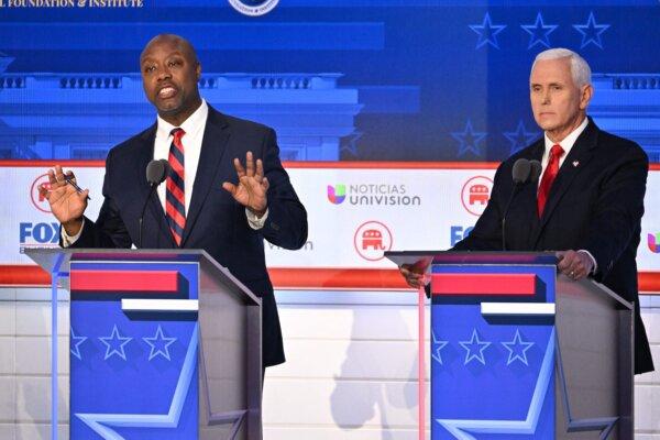 Sen. Tim Scott (R-S.C.) speaks while former Vice President Mike Pence looks on during the second Republican presidential primary debate in Simi Valley, Calif., on Sept. 27, 2023. (ROBYN BECK/AFP via Getty Images)