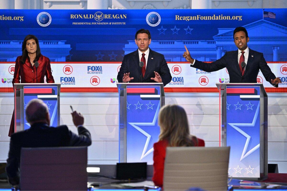 (L–R) Former Governor from South Carolina and UN ambassador Nikki Haley, Florida Gov. Ron DeSantis, and entrepreneur Vivek Ramaswamy speak during the second Republican presidential primary debate in Simi Valley, Calif., on Sept. 27, 2023. (Robyn Beck/AFP via Getty Images)