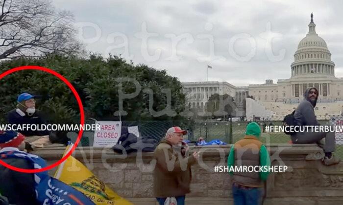 The man known only as #FenceCutterBulwark sits on a stone wall not far from another suspicious actor, #NWScaffoldCommander. Neither man has been publicly identified or arrested. (Courtesy of Chase Matheson/Patriot Punk Network)