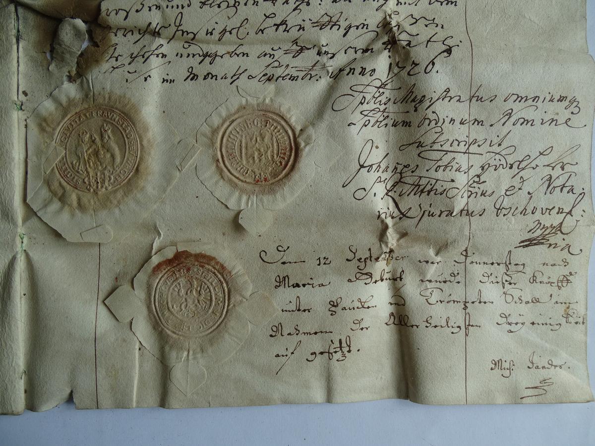 Wafer seals are seen on documents from 1726, which were found inside the time capsule. (Courtesy of Marcin Pechacz)