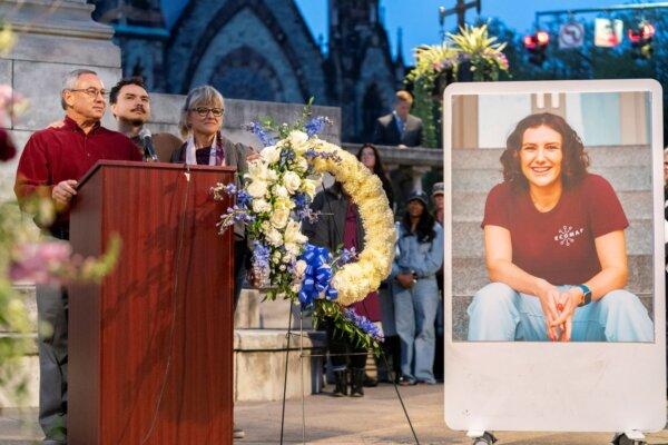 Frank LaPere, Nico LaPere, and Caroline Frank, the family of Pava LaPere, founder of tech startup EcoMap Technologies, speak during a vigil in Baltimore on Sept. 27, 2023. (Stephanie Scarbrough/AP)