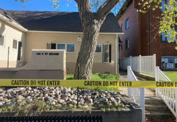 The fire-damaged Wellspring Health Access clinic is cordoned off by tape in Casper, Wyoming, on May 25, 2022. (AP Photo/Mead Gruver)